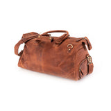 The Leather Duffle Bag Berlin by Vintage Leather Sydney, crafted in brown leather with handles, a shoulder strap, brass hardware, and multiple zippered pockets, is displayed on a white background to highlight its classic design.