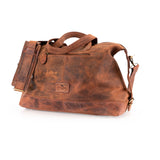 The Leather Duffle Bag Tokyo by Vintage Leather Sydney features dual handles, an adjustable shoulder strap, a front zip pocket, and a logo patch. Crafted from brown leather with a rugged, worn-in finish.