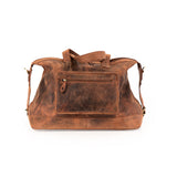 The Leather Duffle Bag Tokyo by Vintage Leather Sydney is a large, brown leather bag with a front zippered pocket, carrying handles, and an adjustable shoulder strap, displayed against a white background.