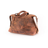 The Leather Duffle Bag Tokyo by Vintage Leather Sydney features a brown leather design with handles, a detachable shoulder strap, and front pocket, boasting a vintage worn-in look against a white background.