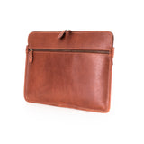 The Leather Laptop Sleeve Signature by Vintage Leather Sydney is a brown leather pouch with a front pocket and top zipper, shown upright on a white background.