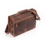 The Leather Messenger Bag Prestige by Vintage Leather Sydney features brown leather, an adjustable strap, brass buckles, front zip pocket, and main compartment. Its vintage look is shown in a worn finish against a white background.