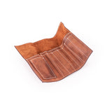 The Leather Artist Roll Zip by Vintage Leather Sydney is a brown leather pouch with white stitching, shown open and empty, featuring multiple compartments—ideal for stylish and practical tool or utensil organization.