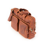 The Leather Messenger Bag Zenith by Vintage Leather Sydney is a brown leather briefcase with two front zippered pockets, detachable shoulder strap, and double handles—an ideal stylish and functional choice for professionals. Photographed on white background.