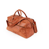 The Leather Duffle Bag Regent by Vintage Leather Sydney is shown on a plain white background, featuring two handles, a detachable shoulder strap, and zippered compartments.