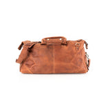 The Leather Duffle Bag Berlin by Vintage Leather Sydney is a brown leather bag with a shoulder strap, short handles, silver hardware, and a vintage look, displayed on a white background.