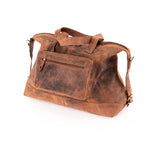 The Leather Duffle Bag Tokyo by Vintage Leather Sydney features brown vintage-style leather, a front zipper pocket, top handles, and an adjustable shoulder strap, displayed on a white background.