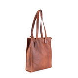Brown leather tote bag on a white background