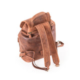Brown leather backpack on a white background