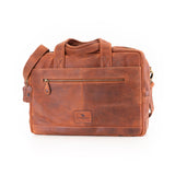 The Leather Messenger Bag Zenith by Vintage Leather Sydney is a brown leather briefcase-style bag with a shoulder strap, two handles, a front zip pocket, and a stitched logo patch, shown on a white background.